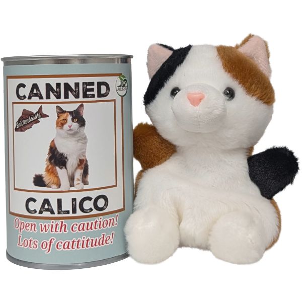A plush calico cat toy sits next to a tin can labeled 'CANNED CALICO' on a plain white background.