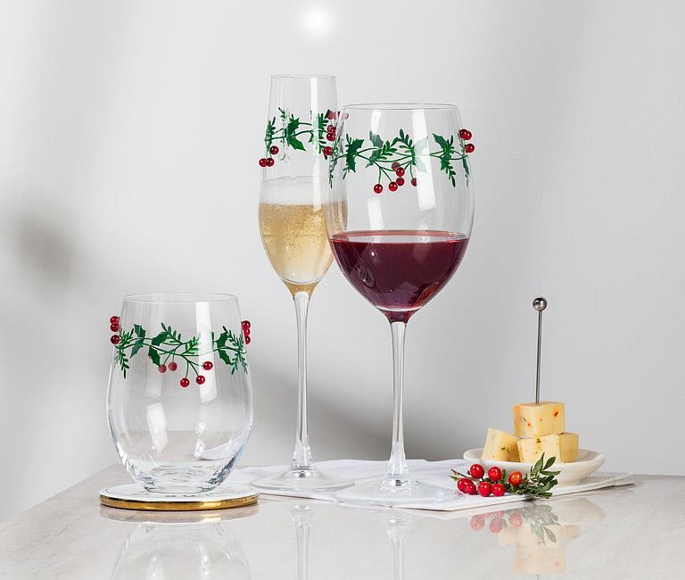 Abbott holly and berries wine glasses filled with red and white wine