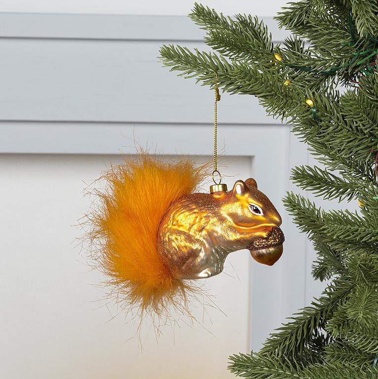 Abbott red squirrel ornament with fur tail hanging on a Christmas tree