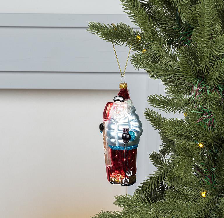 Abbott skier Santa ornament hanging on a Christmas tree