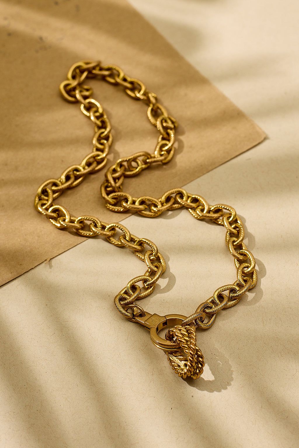Air and Anchor Bound to Be rope knot slider in gold on a chain