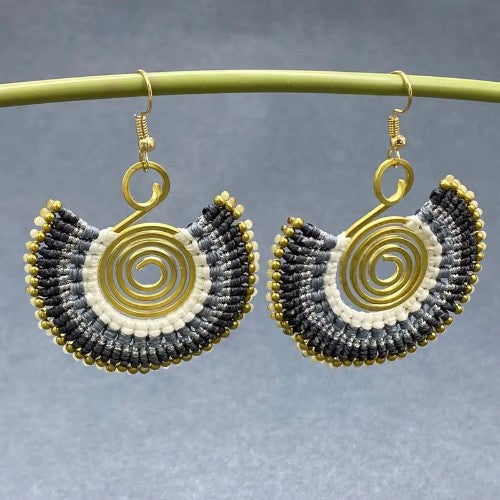 Handmade bohemian fan-shaped dangle earrings with gold-tone spiral wire and black, white, and gold beadwork, a unique artisan gift for her