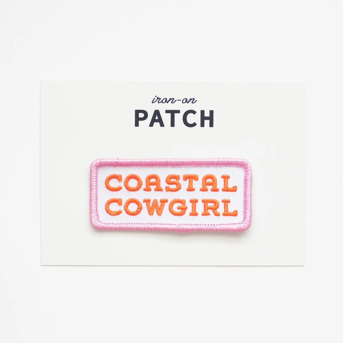 Iron-on patch with 'Coastal Cowgirl' text on a white background