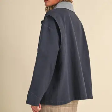 Back side view of the &merci Denim Utility Jacket in indigo showing the relaxed A-line swing shape
