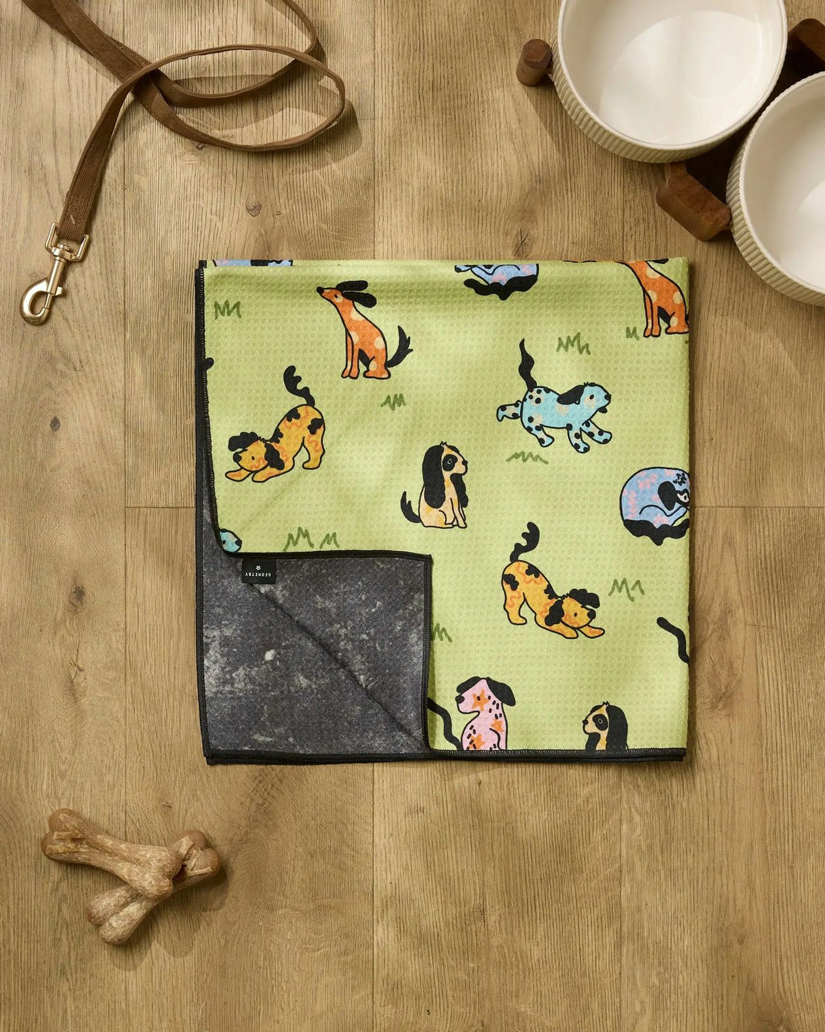 Pet blanket with dog pattern on a wooden surface