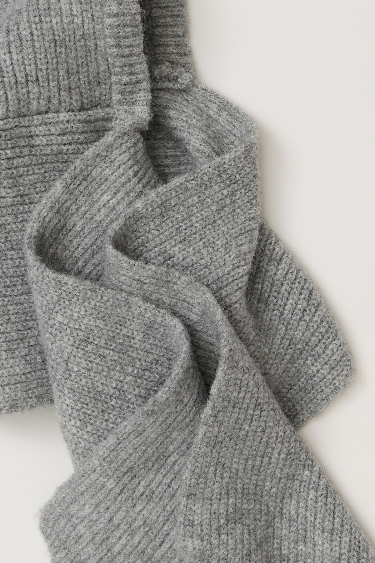 Close-up of the ribbed knit and long scarf ties on the Free People Extra Large Balabonnet in grey