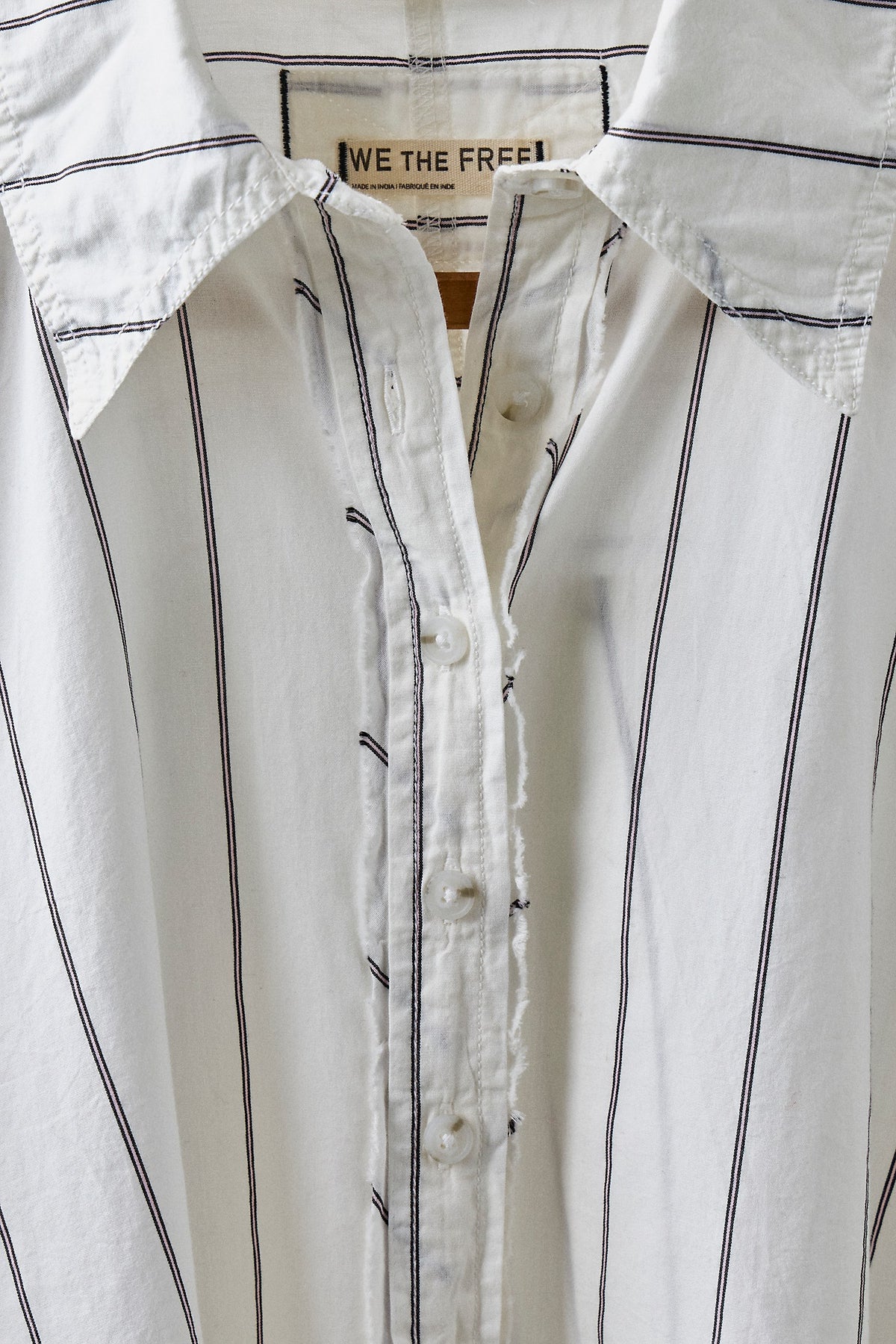 Flat view of the Free People Seaside Cotton Stripe Shirt in Ivory Combo, a pinstripe button-front with collar