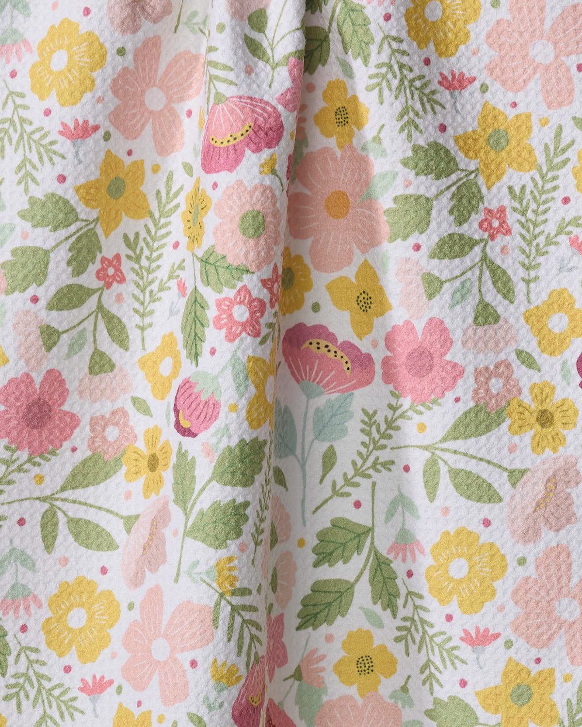 Close-up of the Geometry Blooming Days tea towel floral print and Geoweave texture