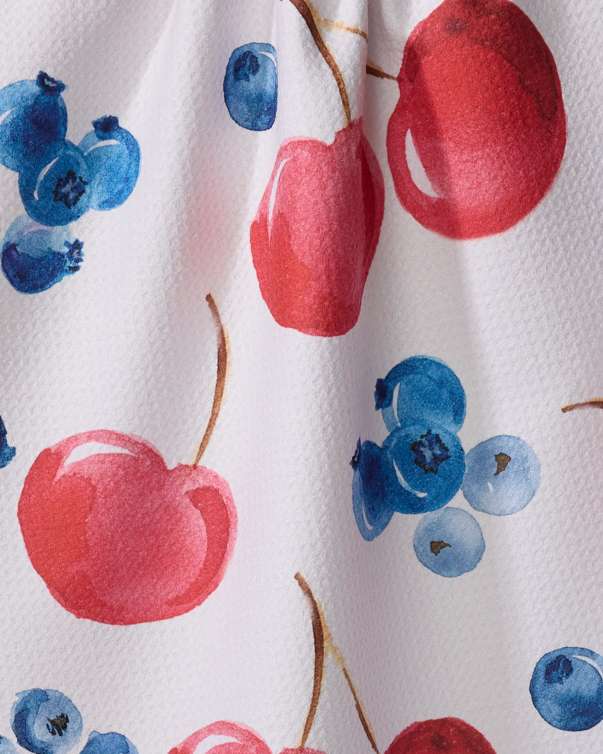 Close-up of the Geometry Cherry On Top tea towel cherry and blueberry print