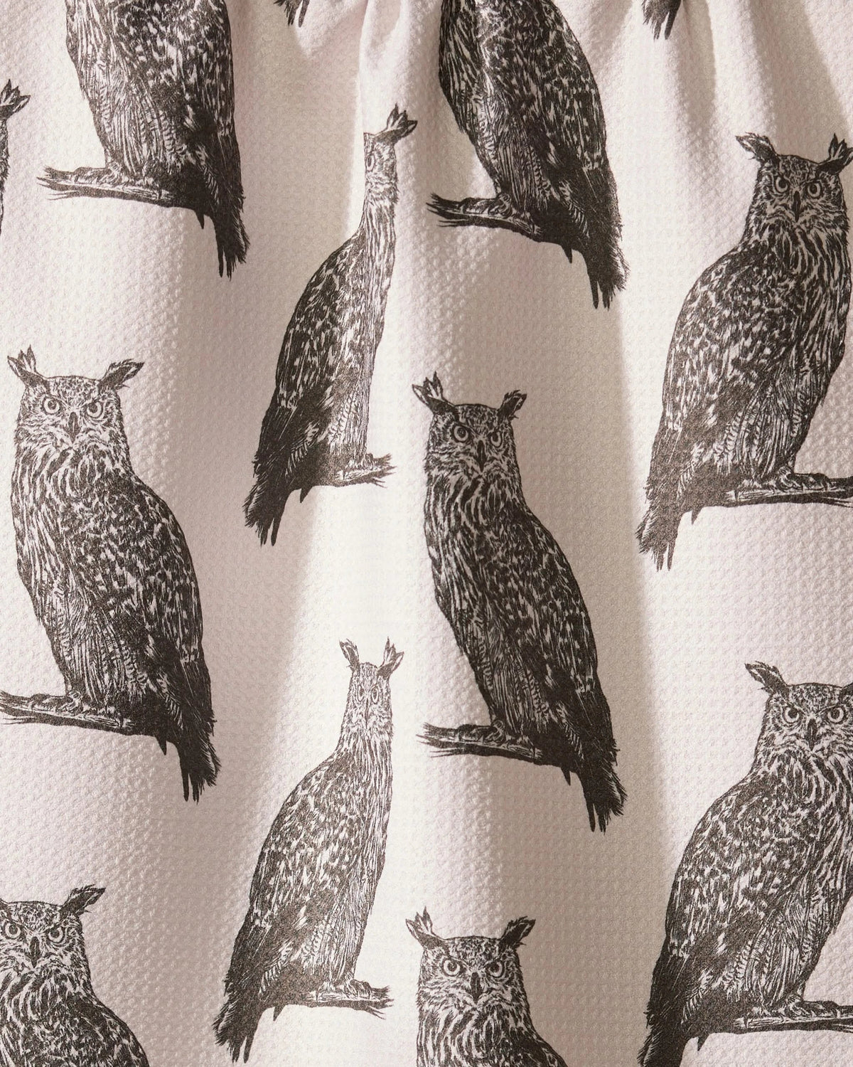 Close-up of the Geometry Nocturne tea towel gray owl print on creamy white