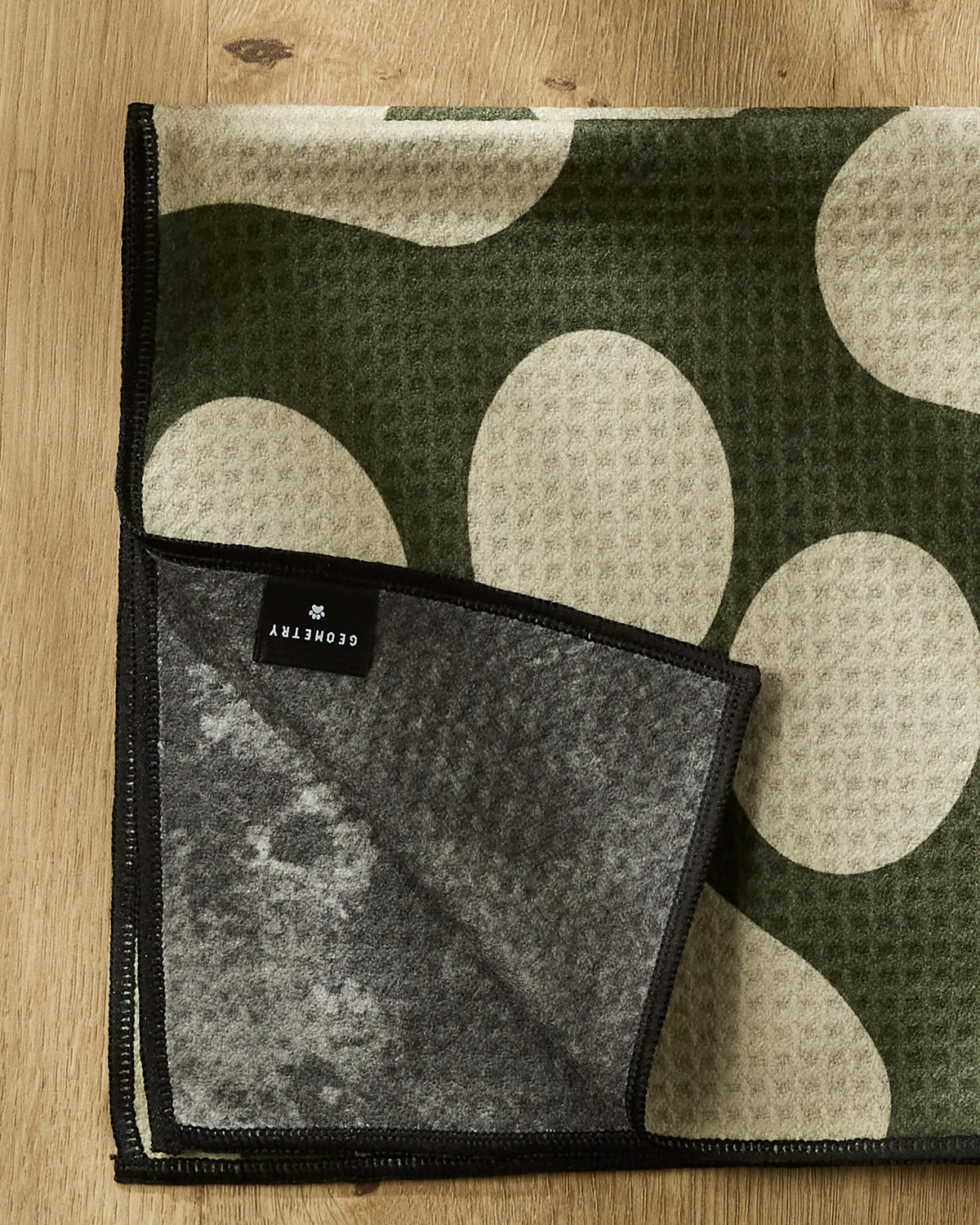 Close-up of the Geometry Paw Prints paw towel print and absorbent Geoweave texture