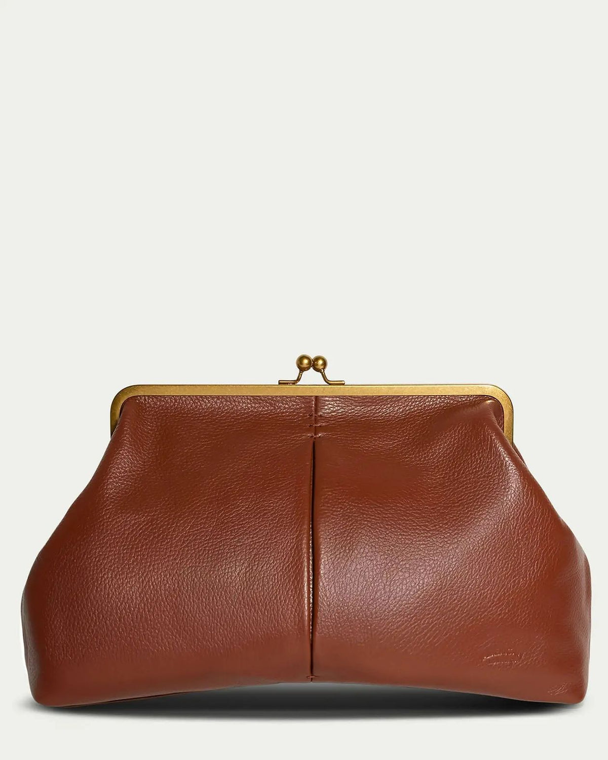 Brown leather clutch bag with gold clasp on a light beige background
