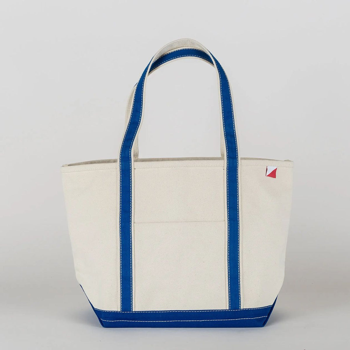 White tote bag with blue accents on a light gray background