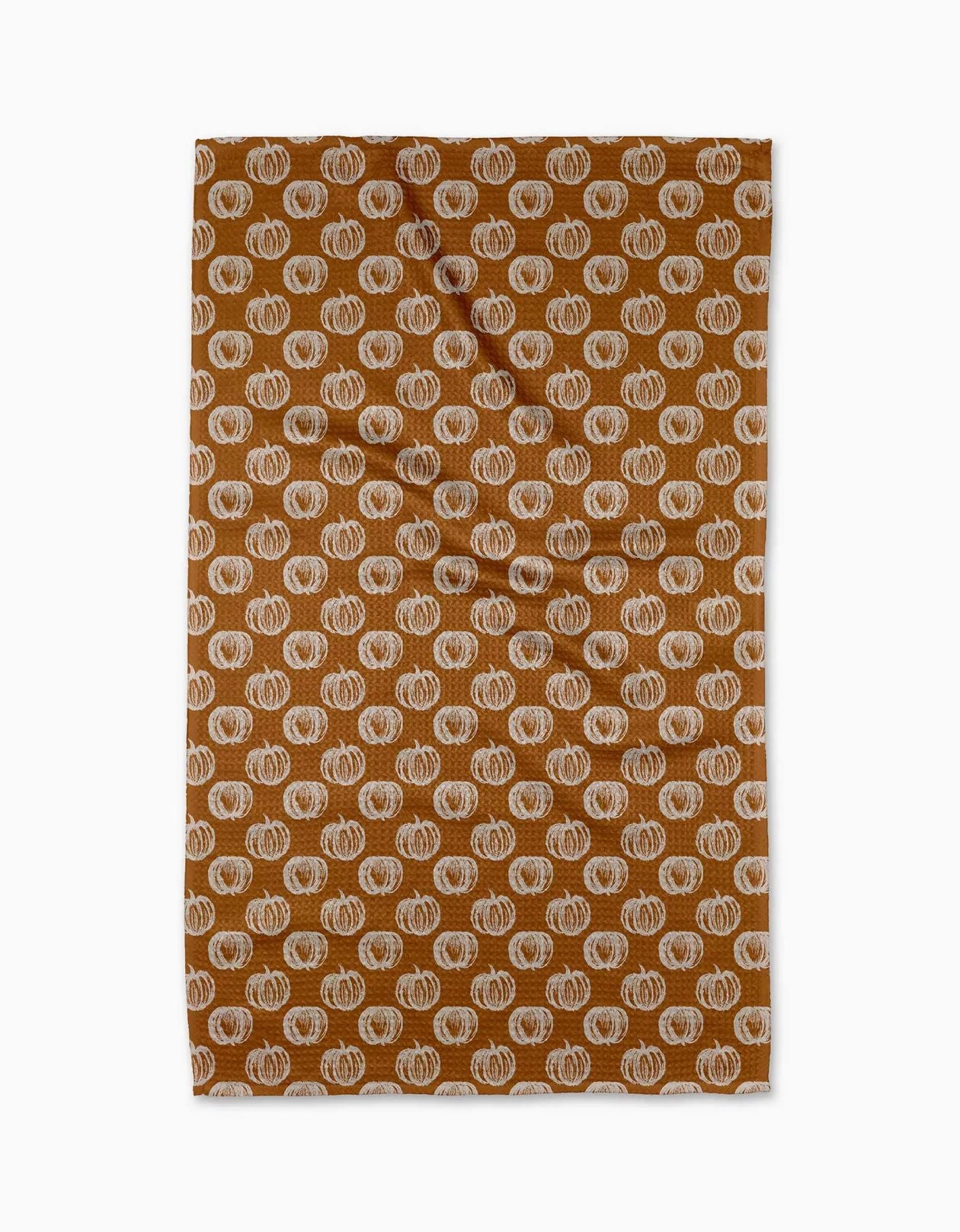 dishtowel featuring a repeating pattern of hand-drawn style orange pumpkins on a warm brown background.