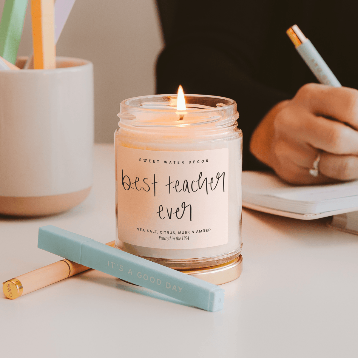 Lit Best Teacher Ever soy candle styled as a thank-you teacher gift