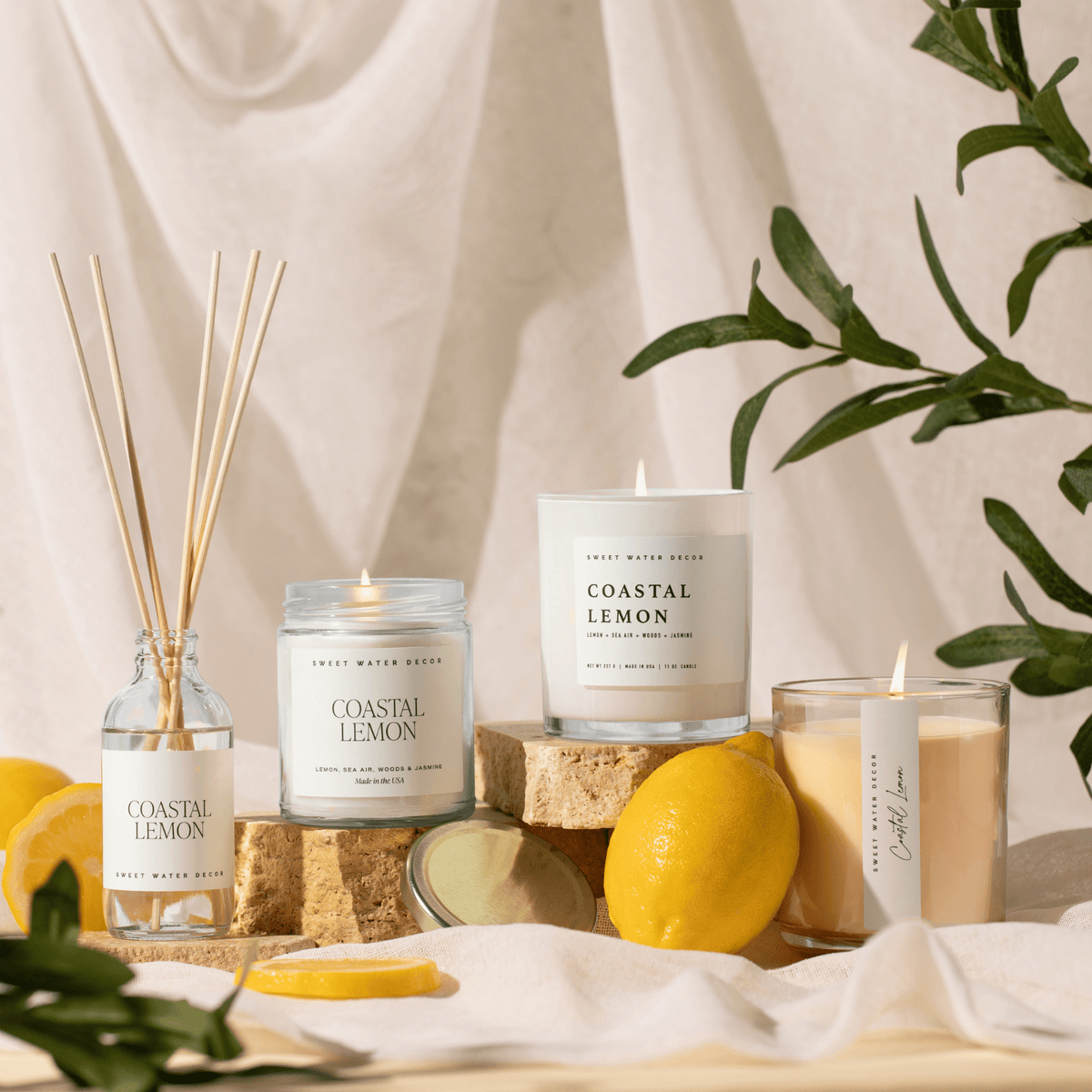 Sweet Water Decor Coastal Lemon candle and reed diffuser styled with lemons for summer decor