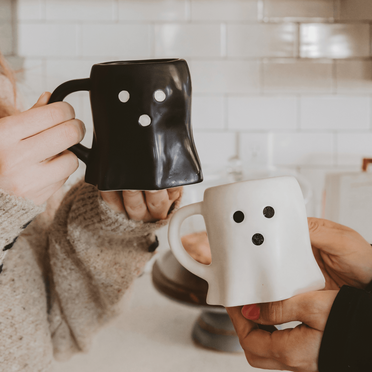 White and black ghost figurine coffee mugs for Halloween