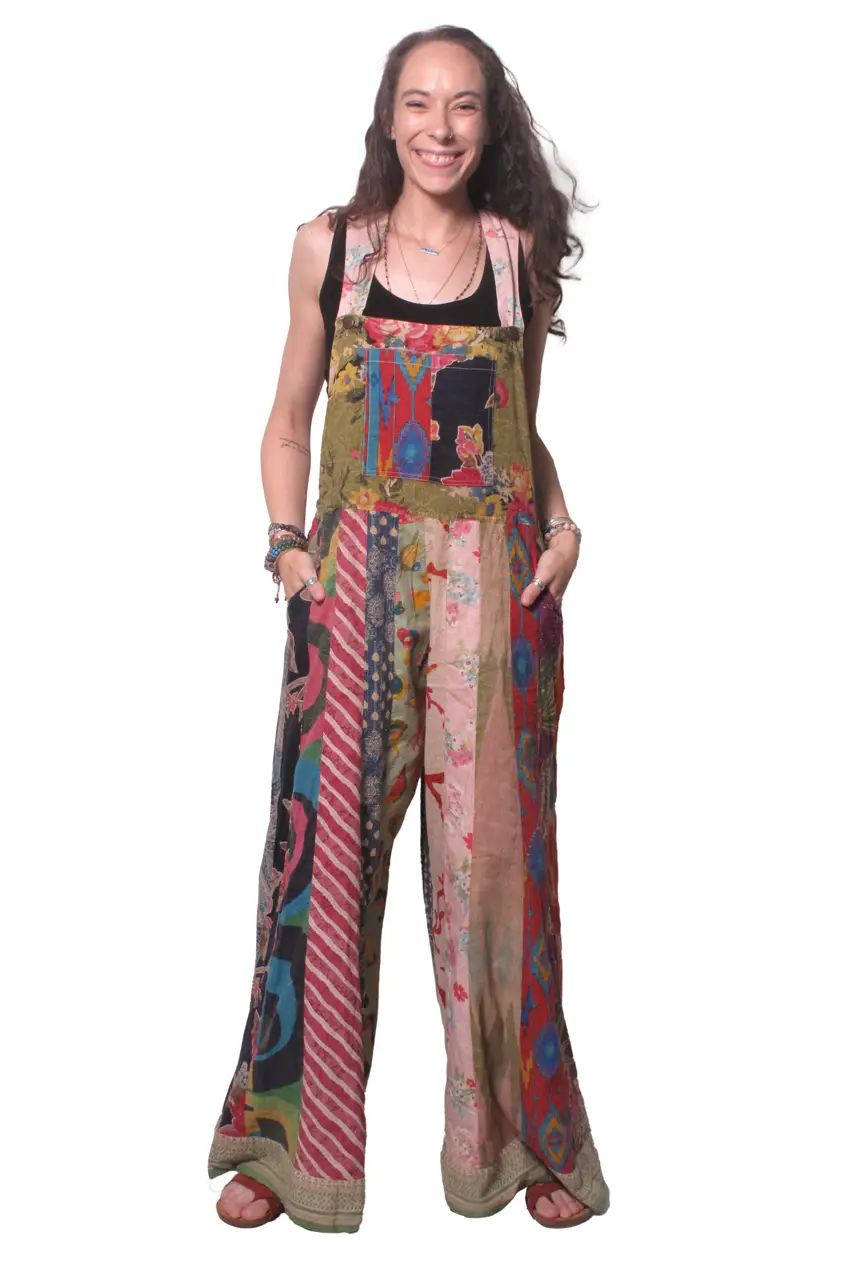 Woman wearing a colorful patchwork overalls on a white background