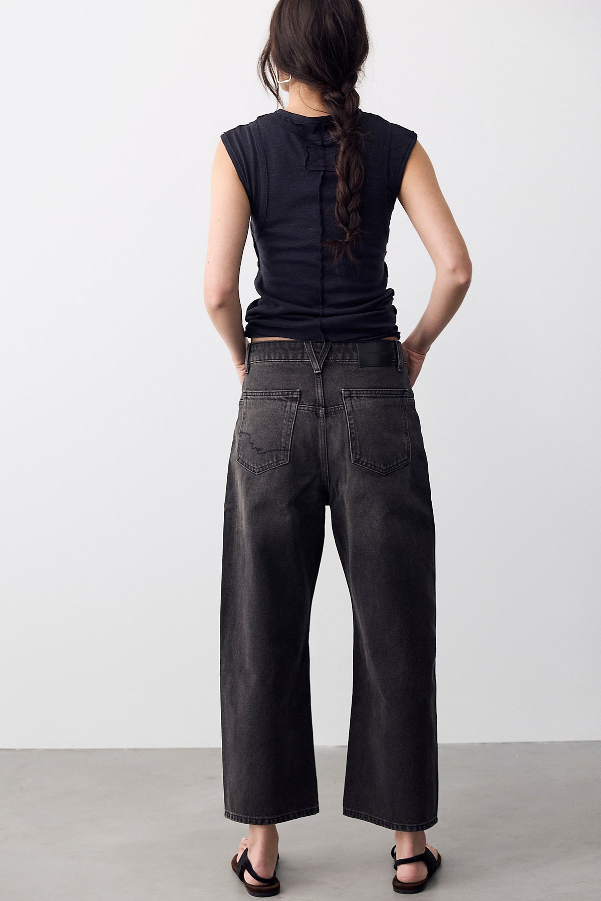 Back view of We The Free Deep Trance Dropped Boyfriend Jeans in Hypnosis washed black with a black tee