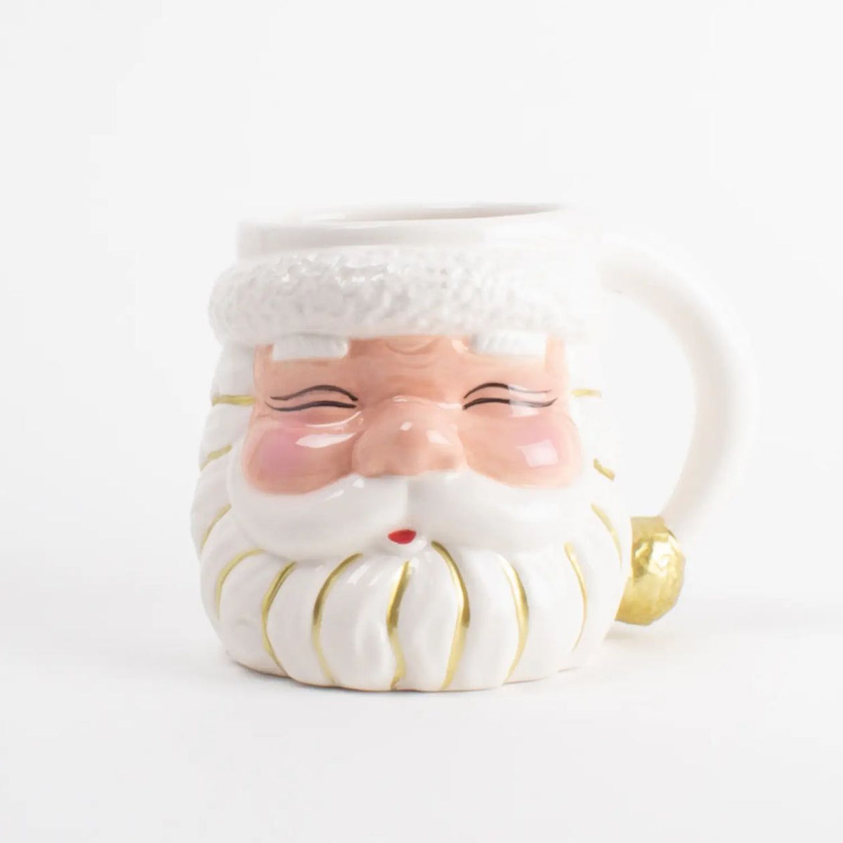 White ceramic Santa face coffee mug with rosy pink cheeks, a curly white beard, and gold accents