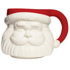 A novelty ceramic mug shaped like Santa's face, featuring a white sculpted beard and face with a red handle and red trim at the top, shown on a plain white background.