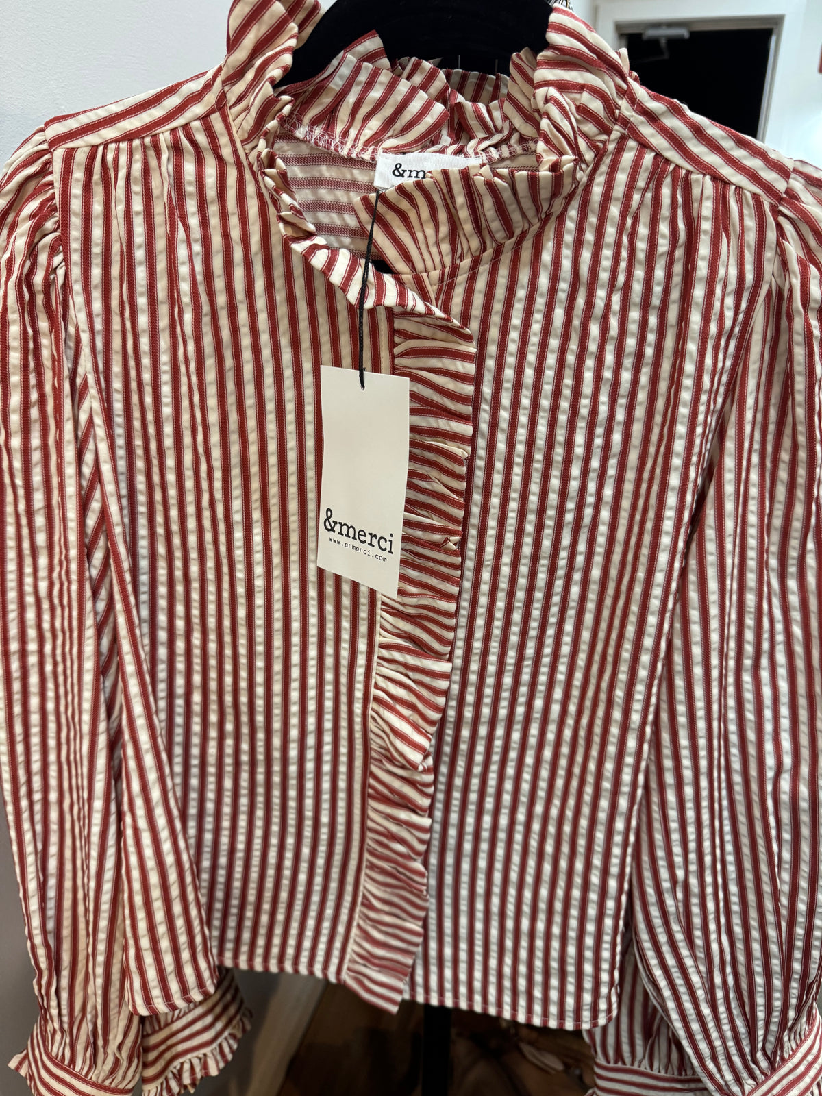 Instore picture of red striped blouse