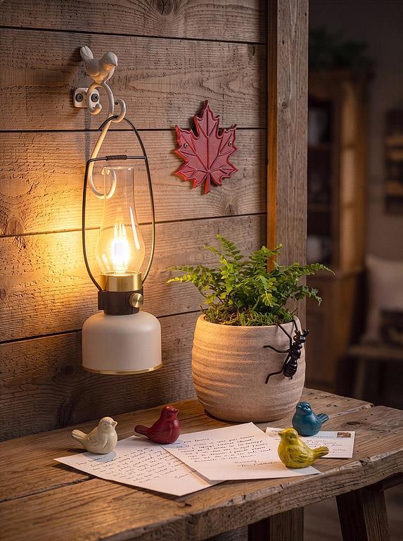 Abbott coarse texture planter on a rustic tabletop with a lantern