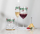Abbott holly and berries wine glasses filled with red and white wine