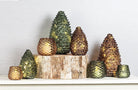 Abbott glass pinecone tealights and lights styled on a birch log
