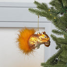Abbott red squirrel ornament with fur tail hanging on a Christmas tree