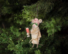 Abbott spa mouse with cucumbers ornament hanging on a Christmas tree