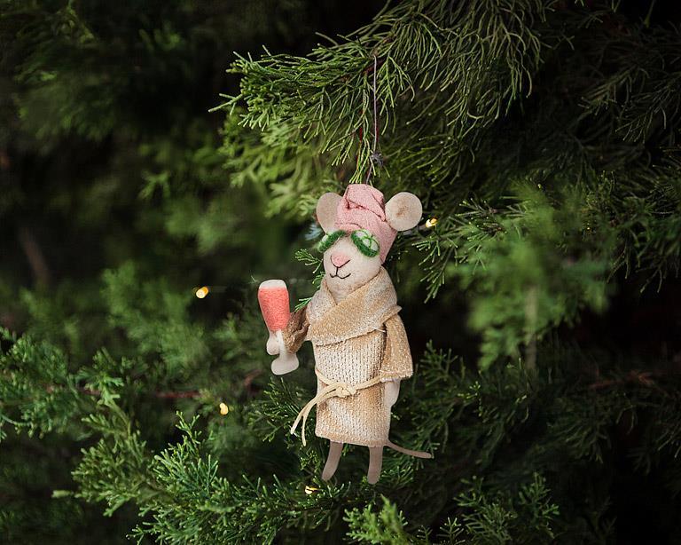 Abbott spa mouse with cucumbers ornament hanging on a Christmas tree