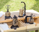 Abbott twine holder with scissors on a garden potting bench