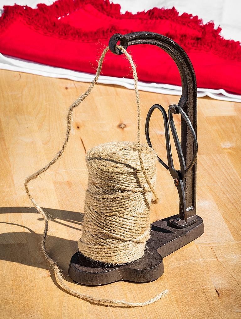 Abbott cast iron twine holder with scissors used for gift wrapping