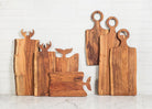 Abbott whale tail handle board with a collection of wooden serving boards