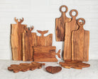 Abbott wood serving boards including the whale tail handle board styled on a counter