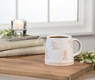 Abbott wide base mug with skiers styled by a window