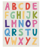 A square fabric or wall art print featuring the alphabet in colorful block letters arranged in four rows on an off-white background.