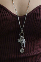 Model wearing the Air and Anchor When Lightning Strikes pendant necklace