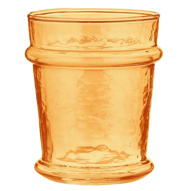 An amber-colored glass cup with a textured, hammered finish and a flared rim, isolated on a white background.