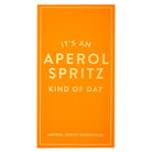 An orange rectangular card or packaging insert with white text reading “IT’S AN APEROL SPRITZ KIND OF DAY” and smaller text “APEROL SPRITZ ESSENTIALS” at the bottom, shown on a white background.