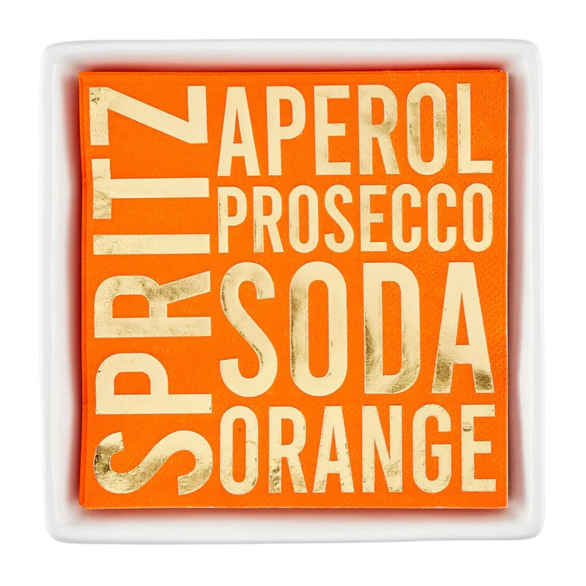 Orange Aperol Spritz cocktail napkins with gold foil lettering in a square white ceramic napkin tray