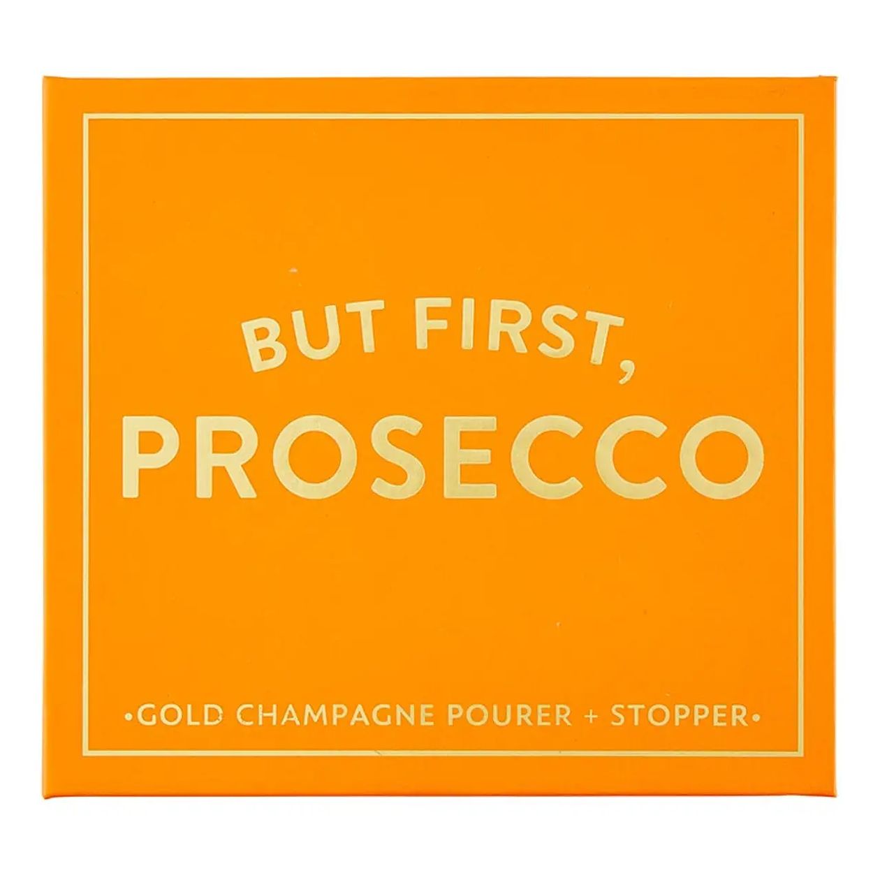 An orange square box with gold lettering that reads 'BUT FIRST, PROSECCO' and smaller text 'GOLD CHAMPAGNE POURER + STOPPER' at the bottom.