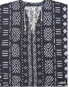 A dark gray knit top with a white geometric tribal pattern and a lace-up front neckline.