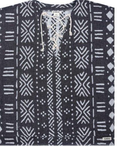 A dark gray knit top with a white geometric tribal pattern and a lace-up front neckline.