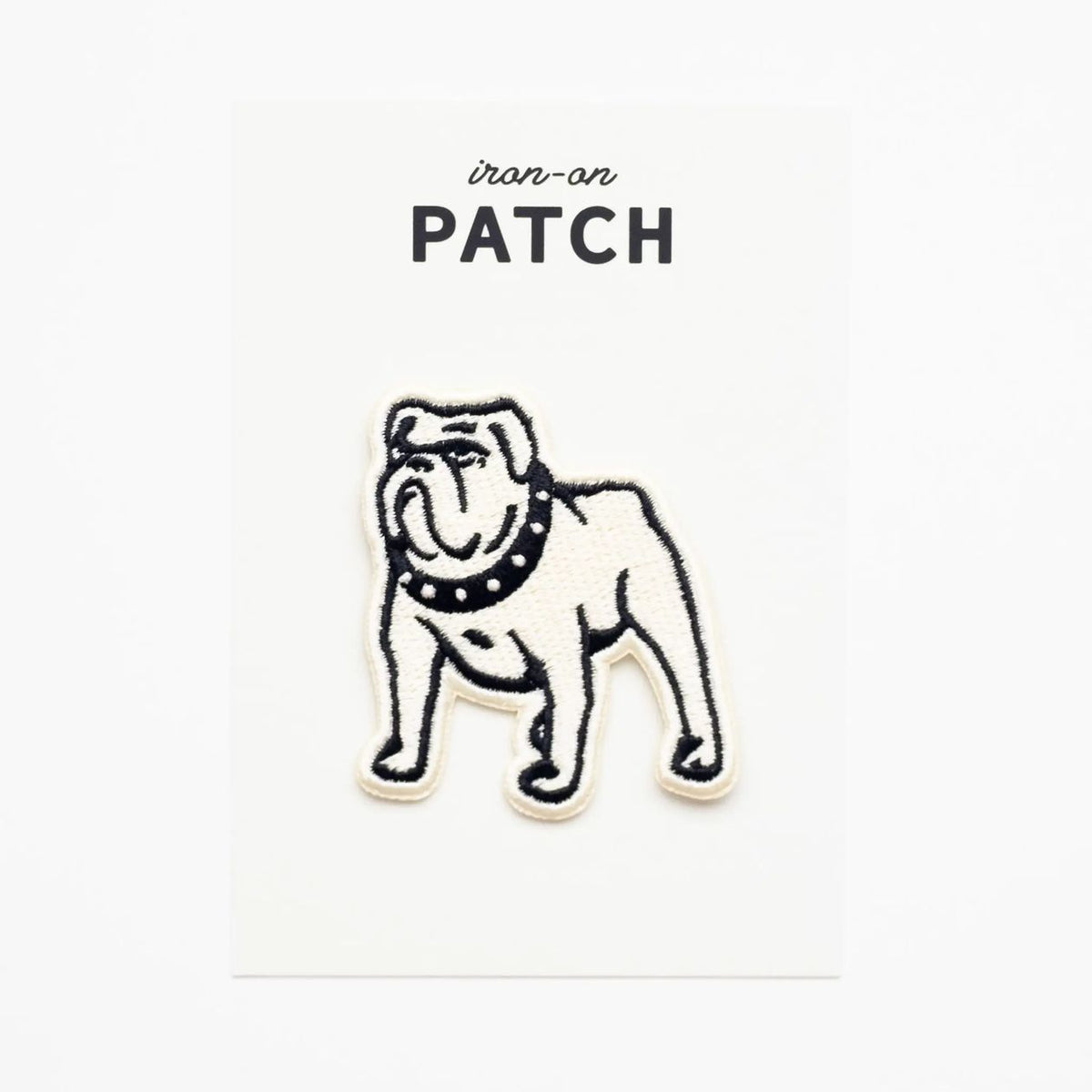 Dog-shaped iron-on patch on a white background with 'iron-on PATCH' text.