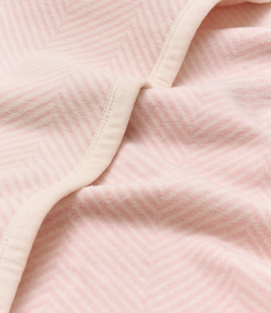 Close-up of the herringbone knit on the Chappywrap Harborview Herringbone Mini Blanket in Ballet Pink