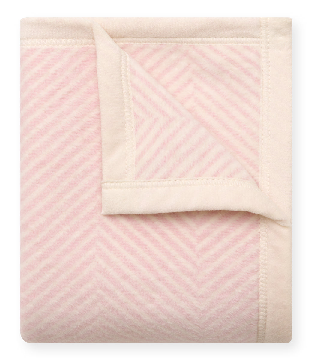 Folded Chappywrap Harborview Herringbone Mini Blanket in Ballet Pink with cream reverse
