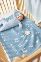 Chappywrap Milestone Mini Blanket in Fog styled in a nursery crib