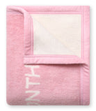 Folded Chappywrap Milestone Mini Blanket in Blush showing the reversible cream side